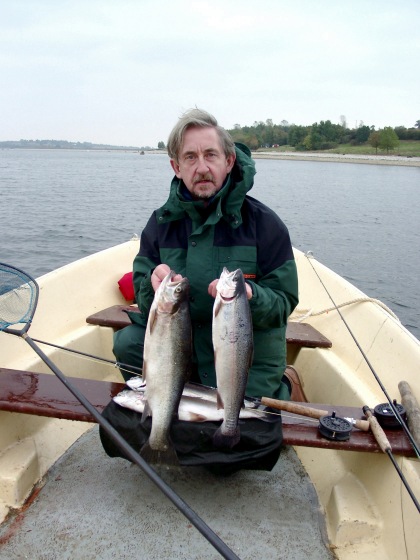 Phill with fry feeding brace of Rainbows