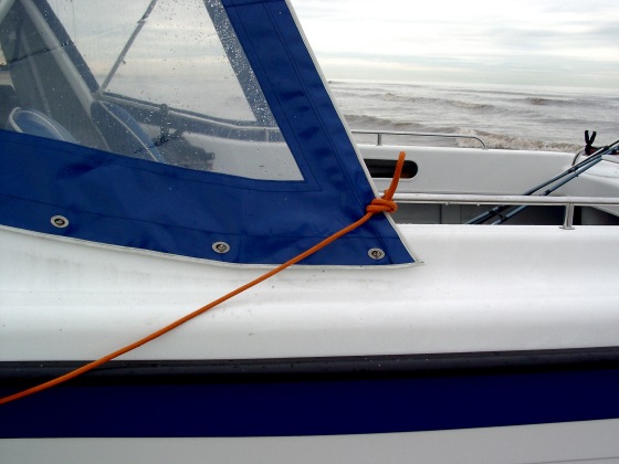 Lazy line draped around side of boat